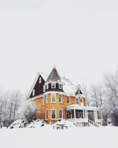 Image of mansion covered in snow