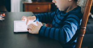 Image of a child on a tablet