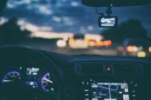 Image of car driving at night