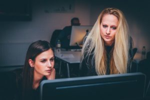 Image of 2 woman working on a computer